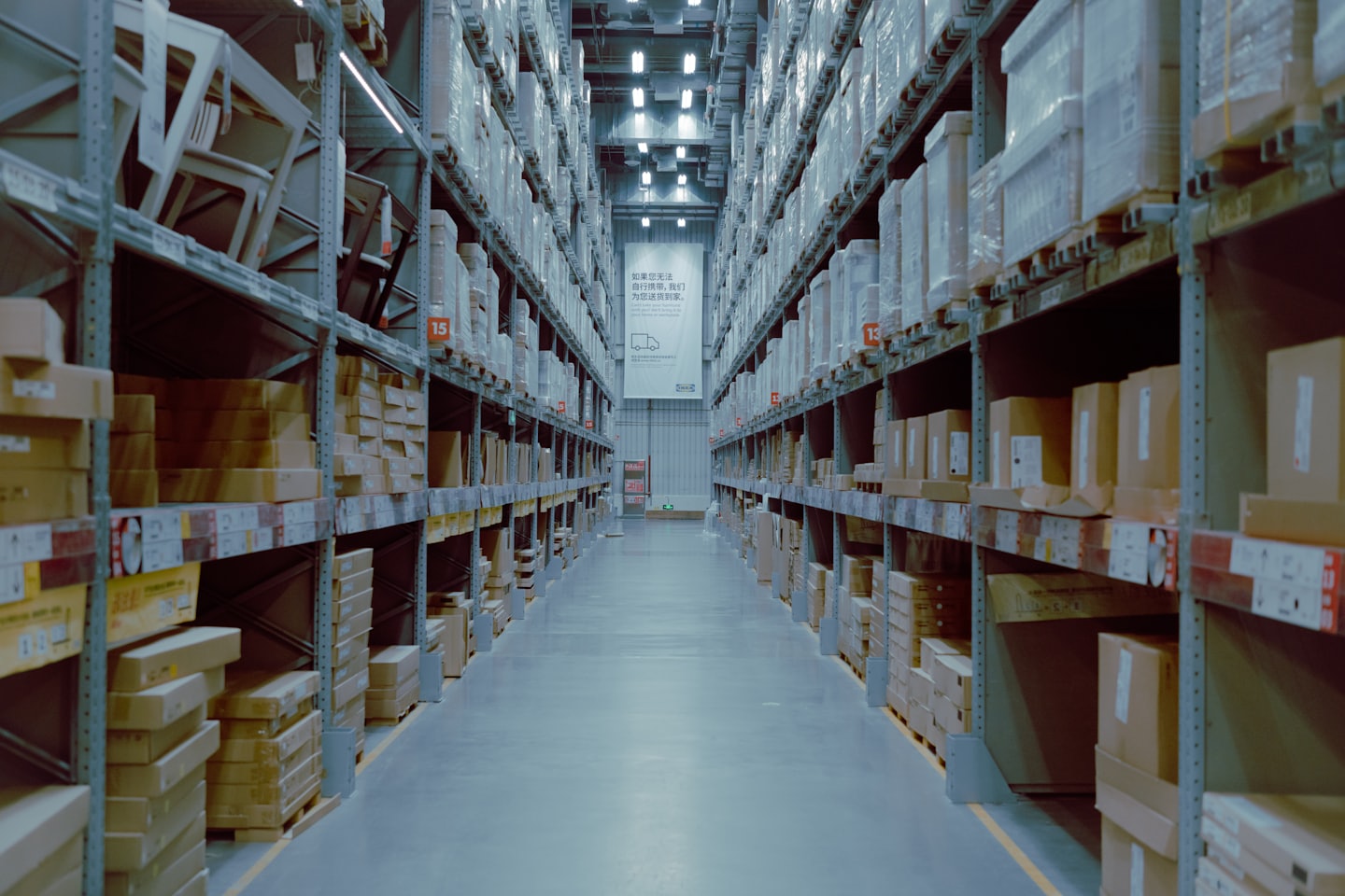 Warehouse aisle stocked with wholesale clothing